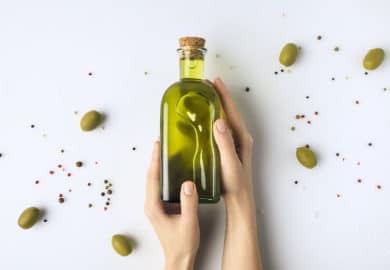 Woman holding olive oil